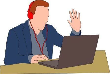 Man using computer with headphones